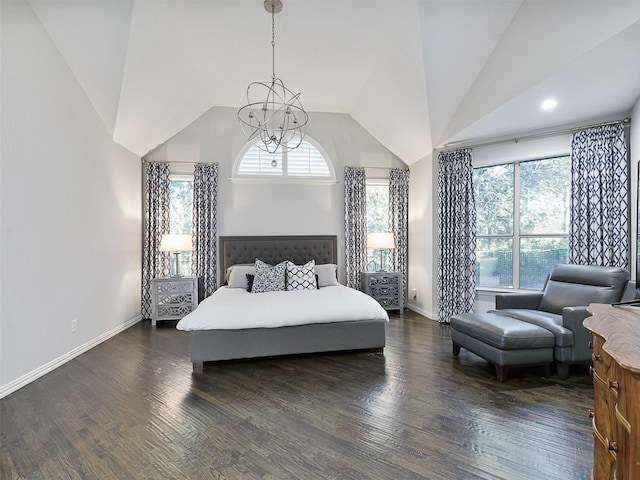 bedroom with dark wood-type flooring, lofted ceiling, and an inviting chandelier