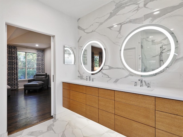 bathroom with a shower, vanity, and hardwood / wood-style flooring