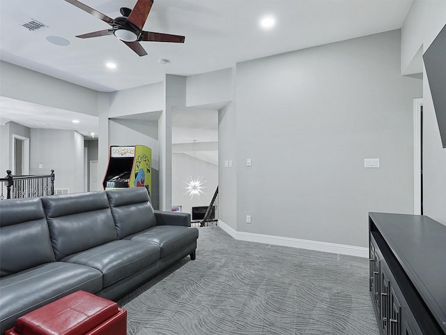 carpeted living room featuring ceiling fan