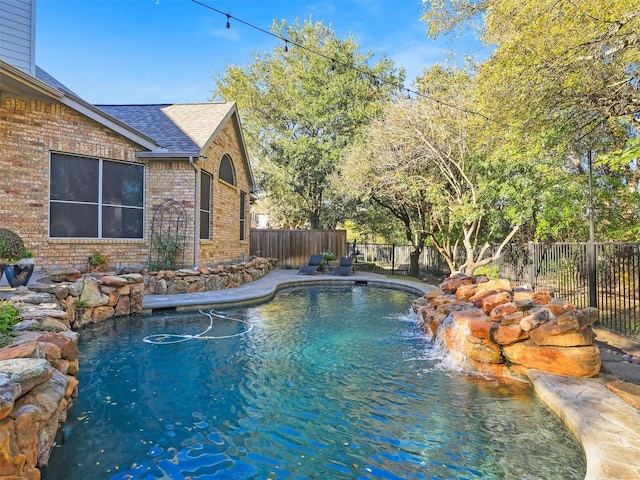 view of pool with pool water feature