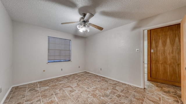 empty room featuring a textured ceiling and ceiling fan