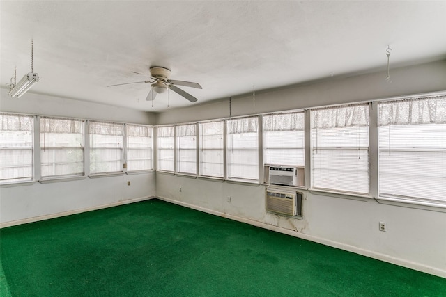 unfurnished sunroom with ceiling fan