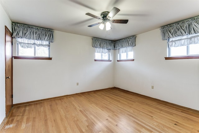 unfurnished room featuring light hardwood / wood-style floors and ceiling fan