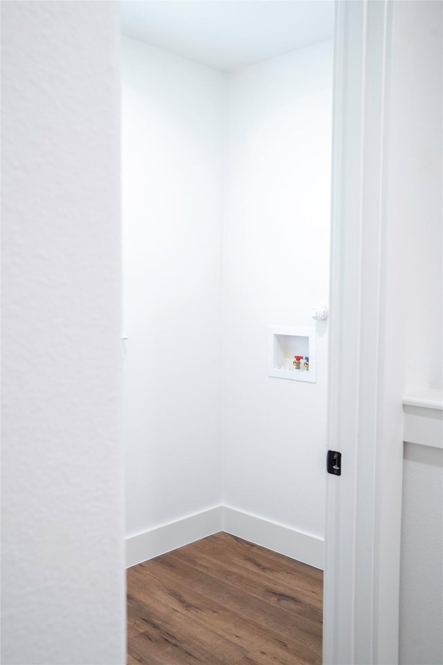 laundry area with hookup for a washing machine and hardwood / wood-style flooring