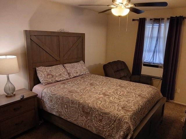 bedroom with dark colored carpet and ceiling fan