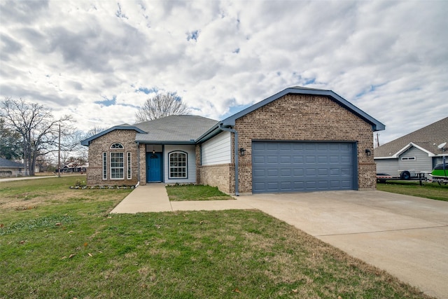 single story home with a garage and a front lawn