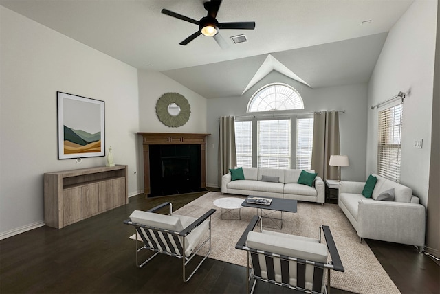 living room with ceiling fan, lofted ceiling, and dark hardwood / wood-style flooring