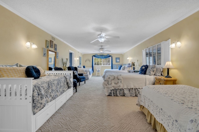 carpeted bedroom with ornamental molding, ceiling fan, and a textured ceiling