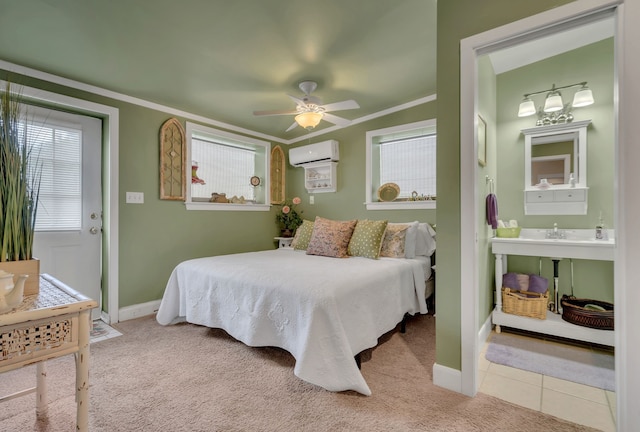 carpeted bedroom with connected bathroom, a wall mounted air conditioner, crown molding, and ceiling fan