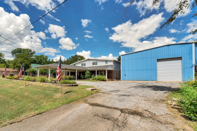 view of front of property featuring a garage and a front yard