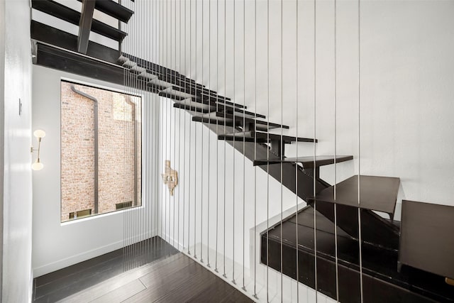 staircase featuring hardwood / wood-style flooring