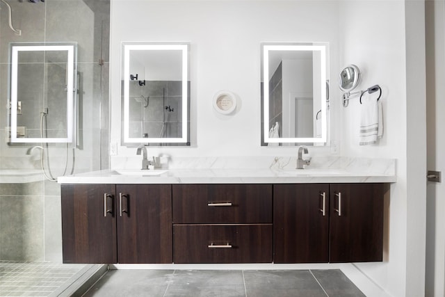 bathroom with tile patterned floors, vanity, and a shower