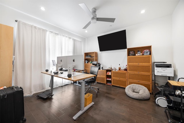 home office with ceiling fan and dark wood-type flooring