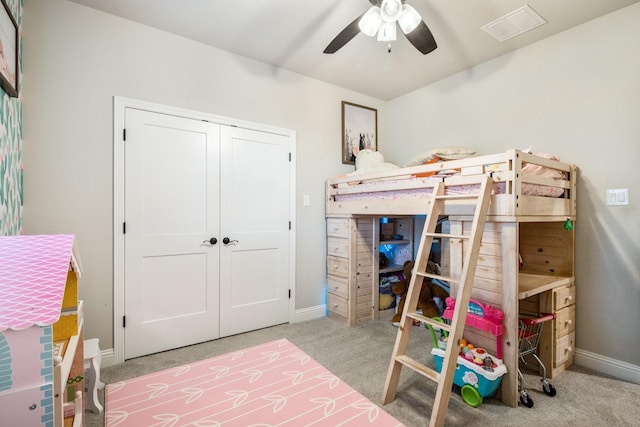 bedroom with a closet, visible vents, baseboards, and carpet floors