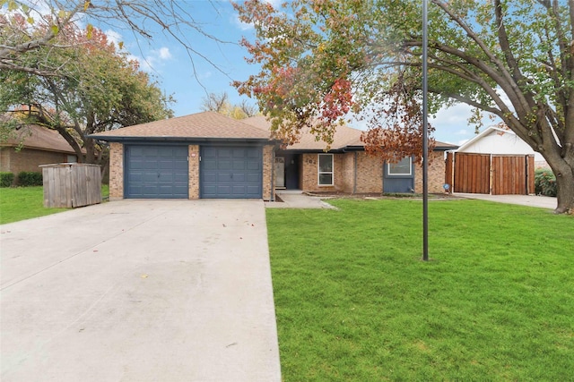 ranch-style home with a garage and a front lawn