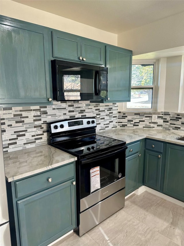 kitchen featuring stainless steel range with electric stovetop, green cabinetry, backsplash, and light stone countertops