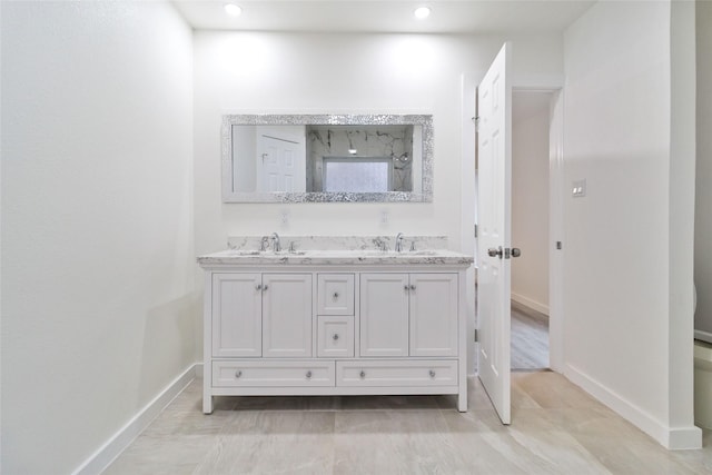 bathroom with vanity and walk in shower