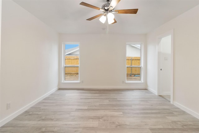 unfurnished room with ceiling fan and light hardwood / wood-style floors