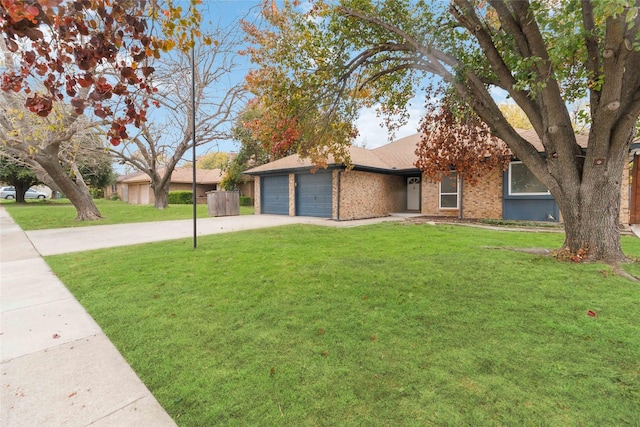 ranch-style home with a front yard and a garage