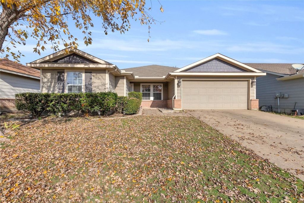 ranch-style house featuring a garage