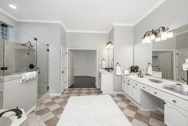 bathroom featuring vanity, a shower with shower door, and ornamental molding