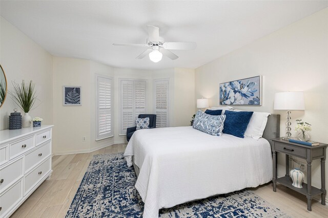 bedroom featuring light wood-type flooring and ceiling fan