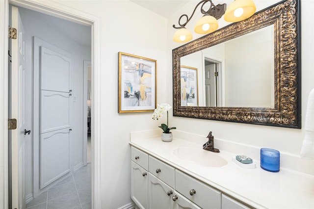 bathroom with tile patterned floors and vanity