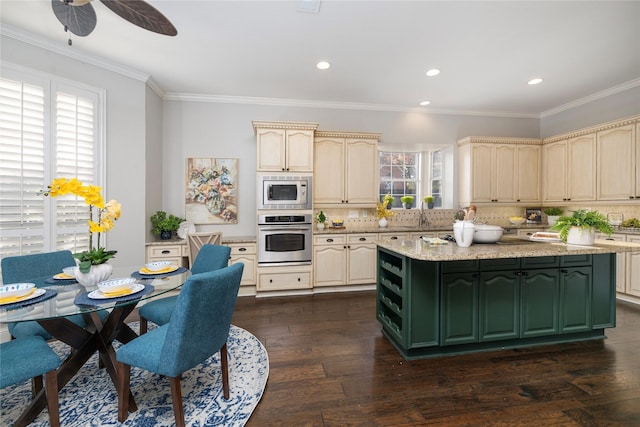 kitchen featuring backsplash, cream cabinets, stainless steel appliances, and dark hardwood / wood-style floors