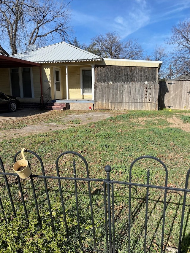 view of yard featuring covered porch