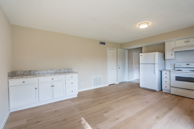 kitchen with white cabinets, white appliances, a textured ceiling, and light hardwood / wood-style flooring