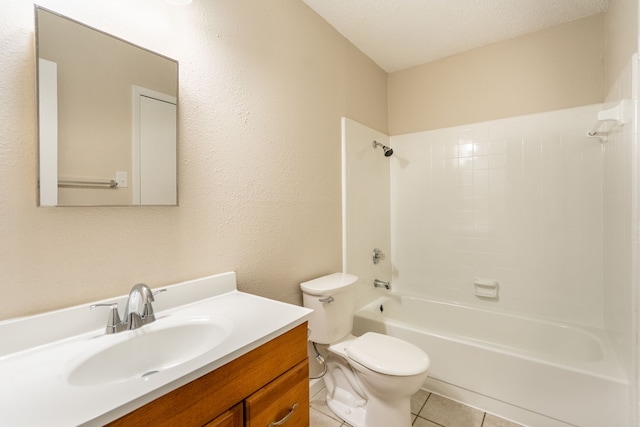 full bathroom with tile patterned flooring, a textured ceiling, toilet, shower / washtub combination, and vanity