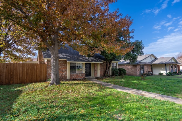 ranch-style house featuring a front lawn