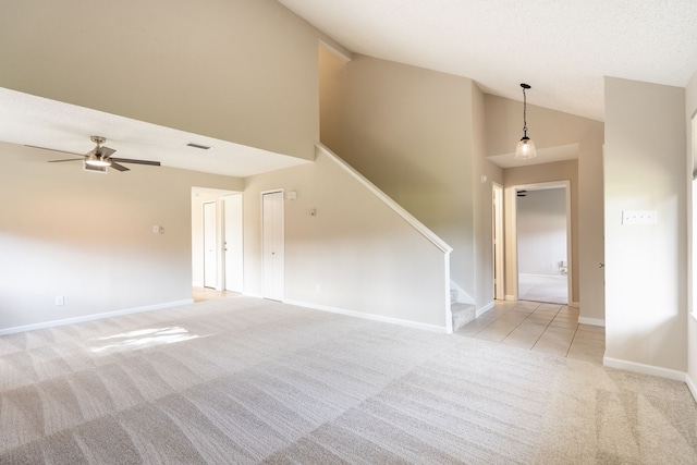 interior space with light colored carpet, high vaulted ceiling, and ceiling fan