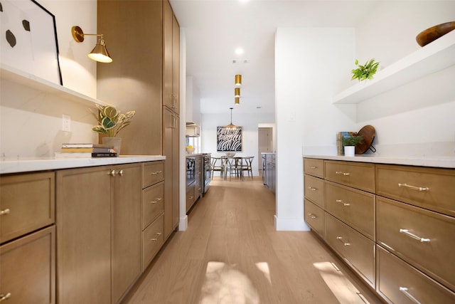 kitchen featuring pendant lighting and light hardwood / wood-style flooring