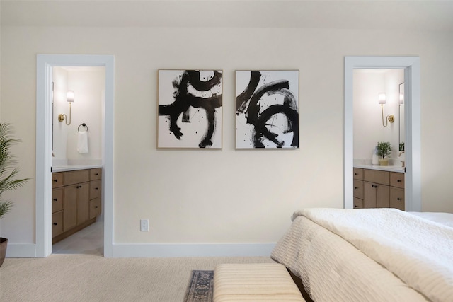 carpeted bedroom with ensuite bathroom