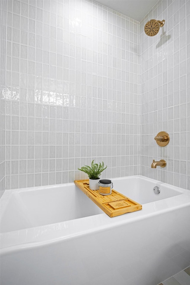 bathroom with tiled shower