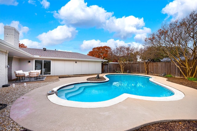 view of swimming pool featuring a patio area