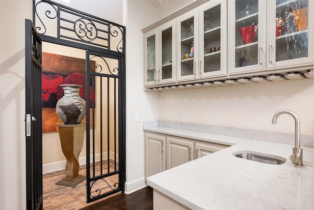 kitchen featuring sink and dark hardwood / wood-style floors