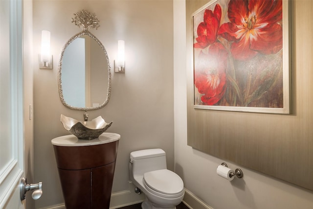 bathroom with sink and toilet