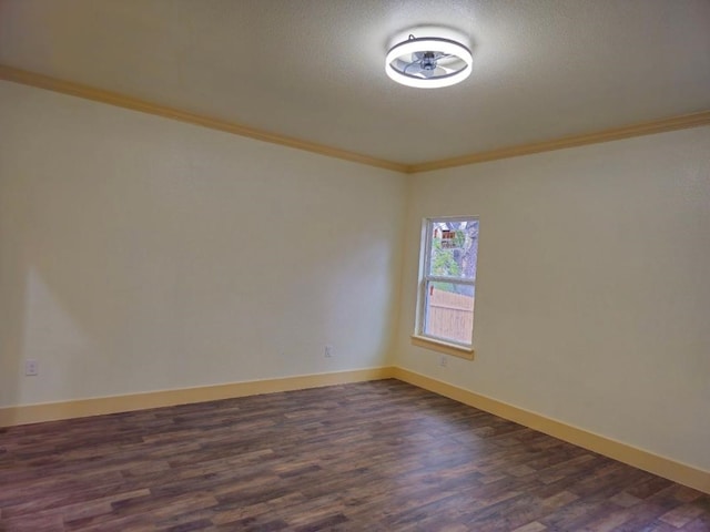 unfurnished room with crown molding, dark hardwood / wood-style flooring, and a textured ceiling