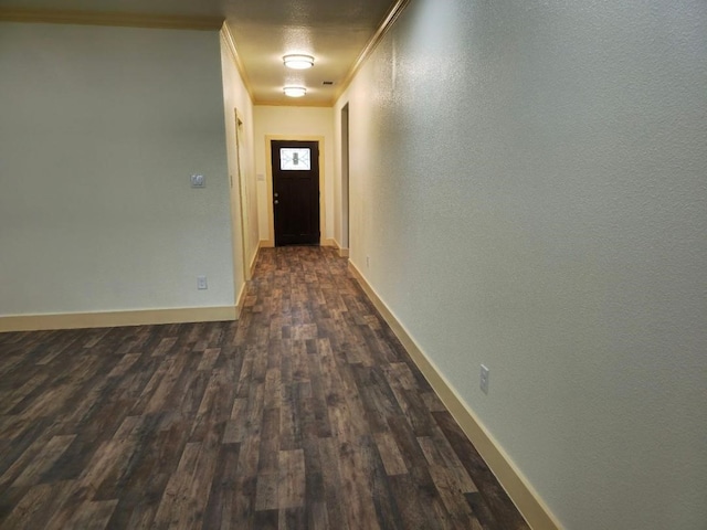 hall with crown molding and dark hardwood / wood-style flooring