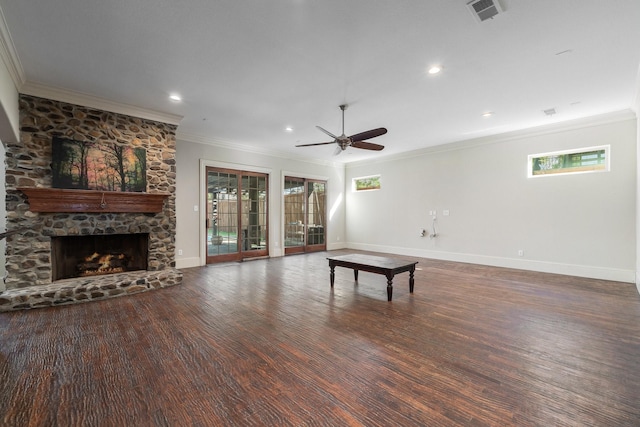 unfurnished living room featuring ceiling fan, dark hardwood / wood-style floors, crown molding, and a fireplace