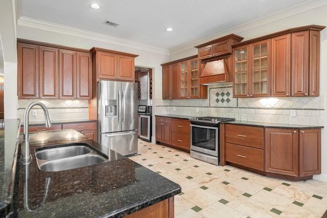 kitchen with sink, custom range hood, stainless steel appliances, and ornamental molding