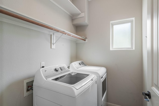 laundry room with separate washer and dryer