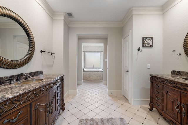 bathroom with tile patterned floors, a washtub, crown molding, and vanity