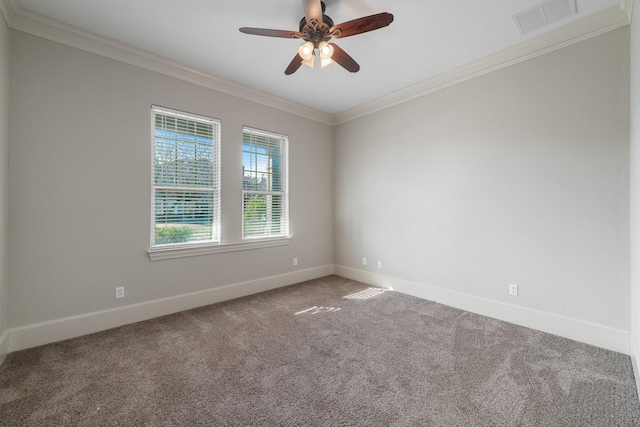 spare room with carpet floors, ceiling fan, and crown molding