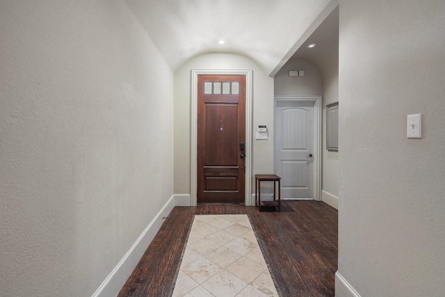 foyer featuring light hardwood / wood-style floors and vaulted ceiling