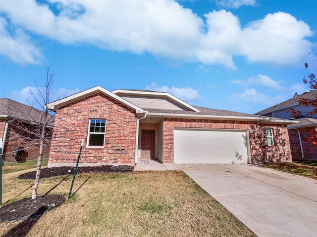 ranch-style house featuring a garage and a front lawn