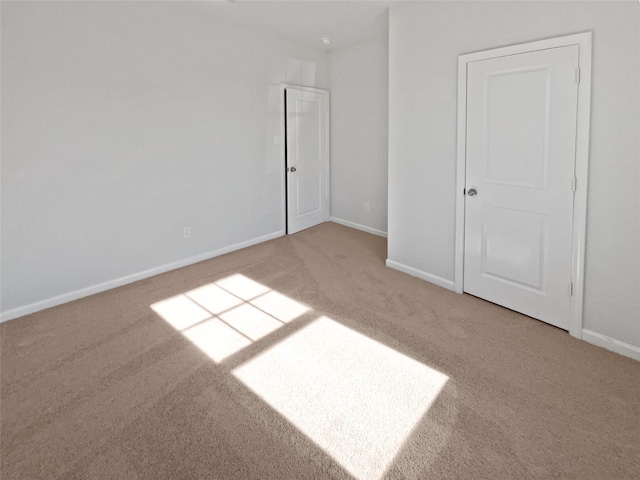 spare room with carpet floors