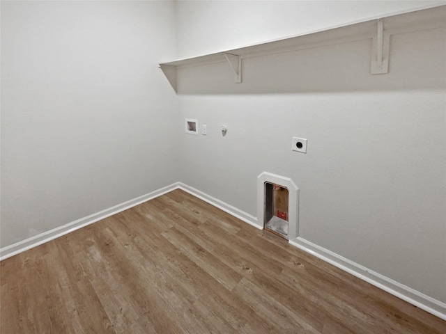 laundry room with washer hookup, hookup for a gas dryer, electric dryer hookup, and wood-type flooring